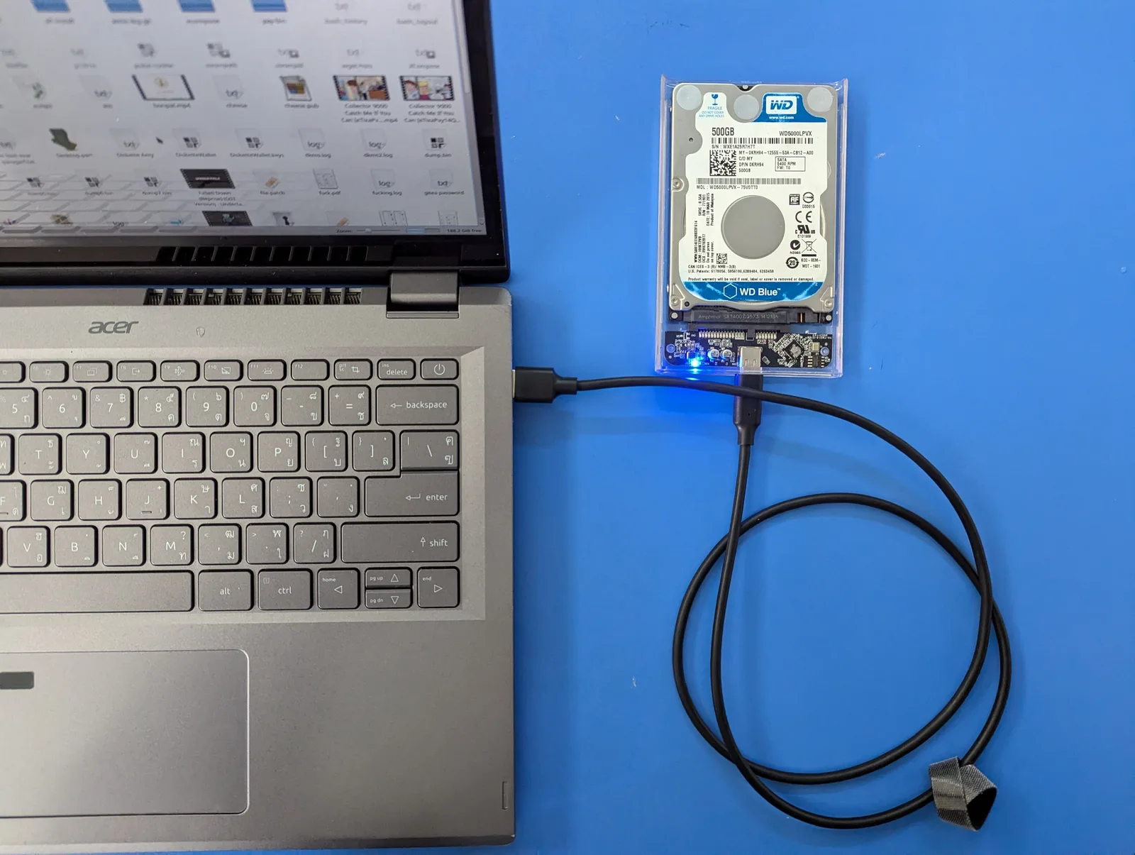 External hard disk drive connected to a laptop with a USB-C cable