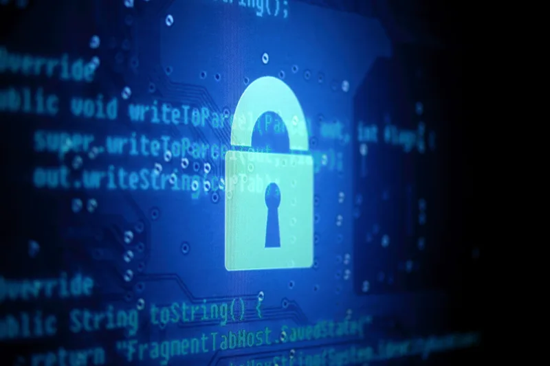 Glowing padlock graphic over blue lines of program code on a dark background