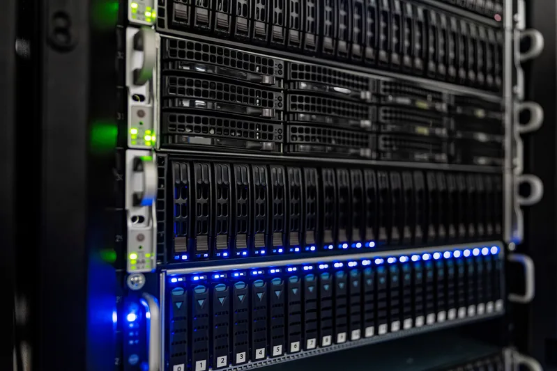 Open server racks with networking equipment and neatly bundled cables