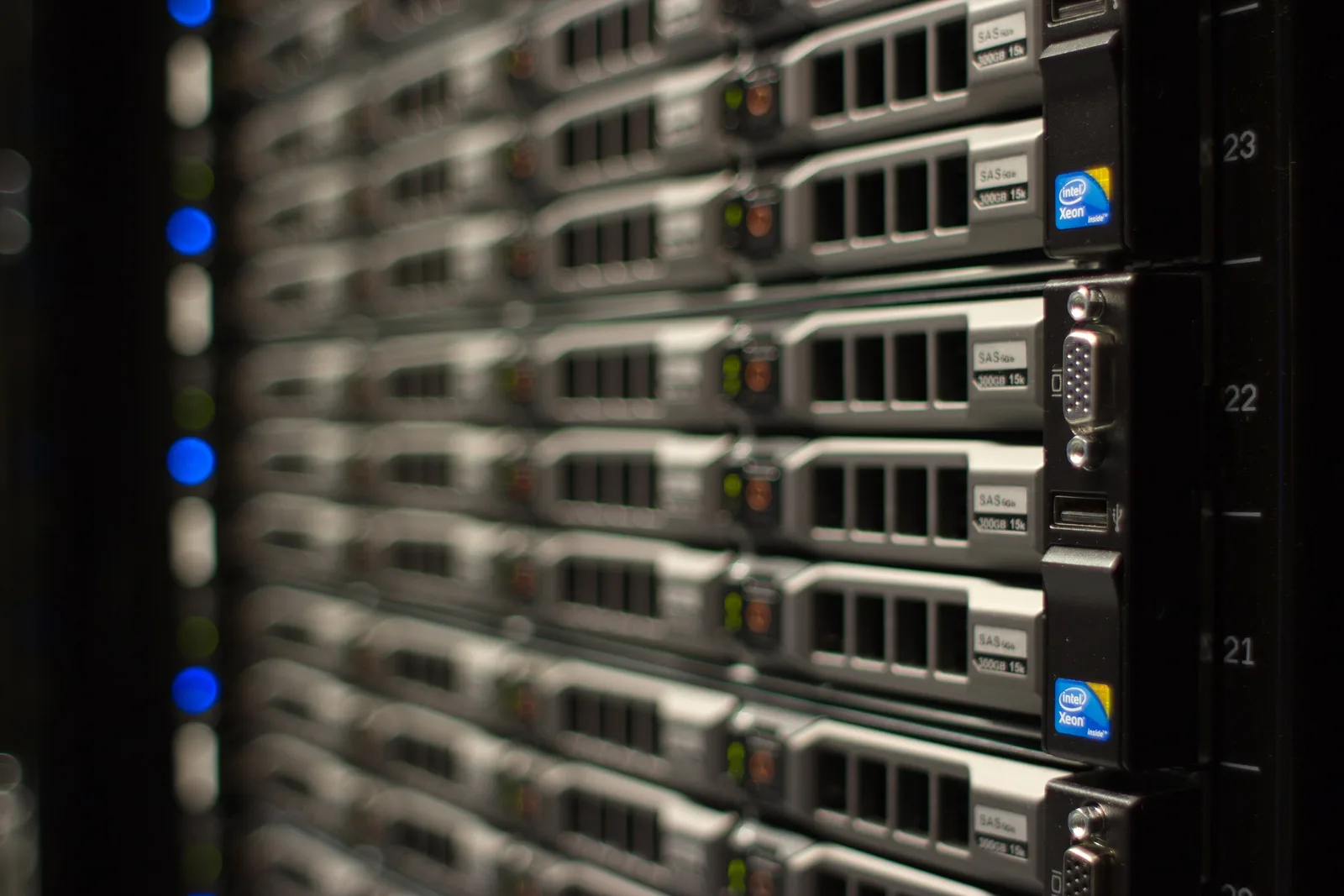Close-up of rack-mounted servers with drive bays and numbered rack units in a data centre