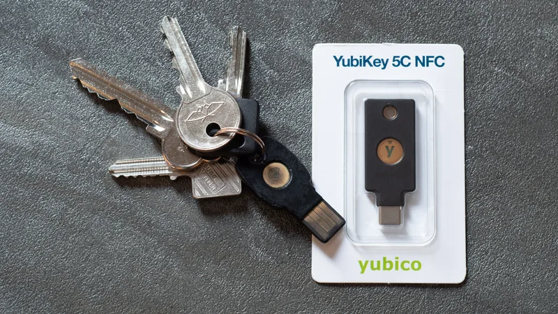 YubiKey 5C NFC hardware security key with USB-C connector lying on a plain surface