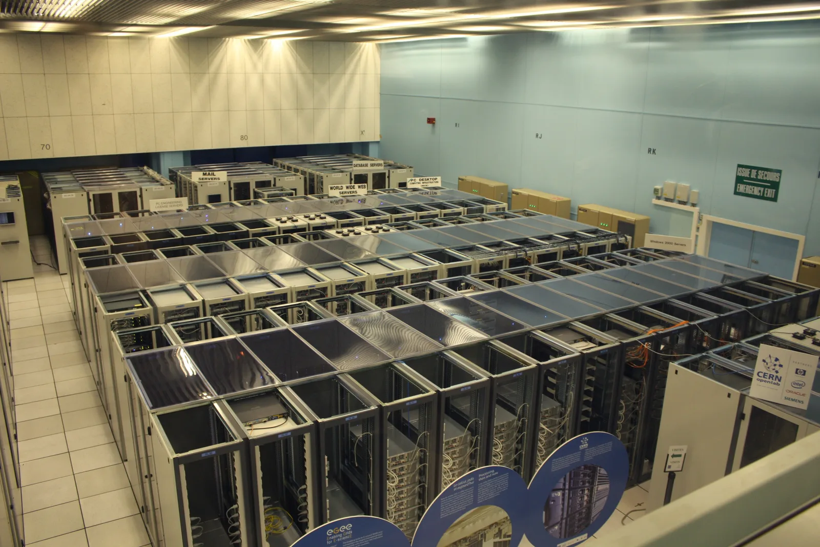 Long aisle of server racks inside the CERN data centre in Geneva