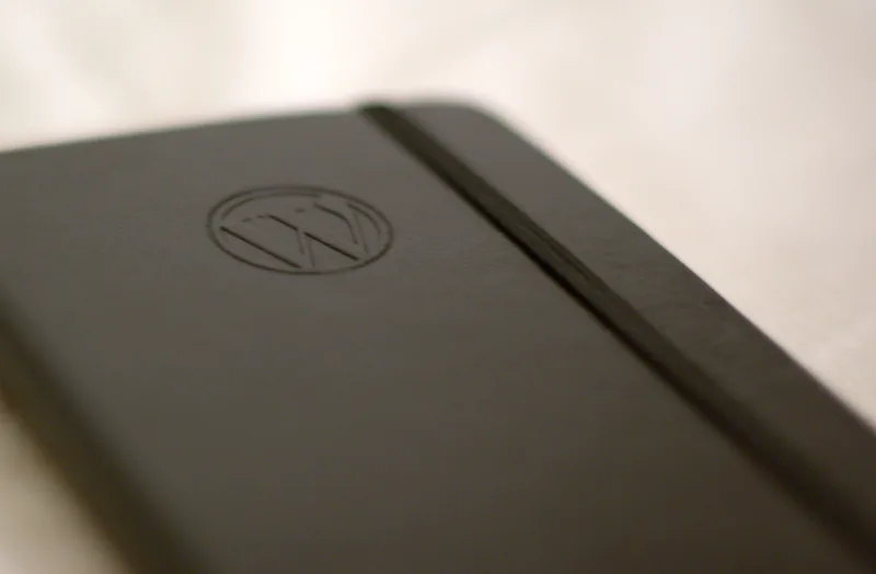 Moleskine paper notebook branded with the WordPress logo, used for sketching ideas