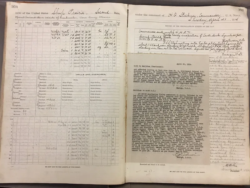 Open 1914 logbook of the USS Prairie with hourly handwritten weather entries, a typed account of events pasted in, officers' signatures and an 'examined and found correct' line