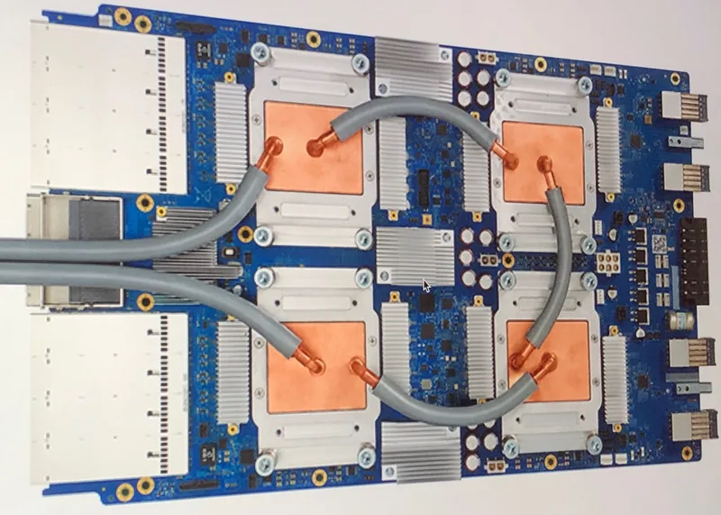 Photo of a Google Tensor Processing Unit 3.0 board with its large heat sinks and connectors, the kind of accelerator hardware that serves model API calls