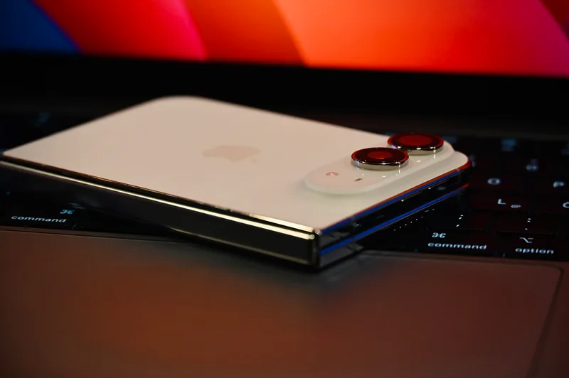 iPhone Duo lying closed on a desk, showing its rear camera.